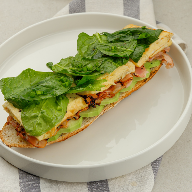 Scrambled eggs with avocado and bacon